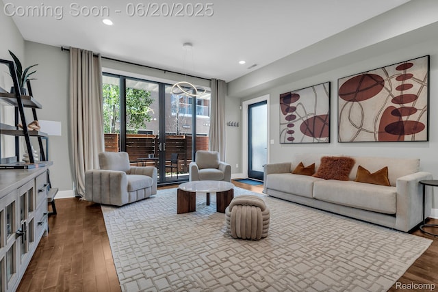 2648 John R St, Detroit, MI 48201 - living room with dark wood-style flooring, recessed lighting, and a chandelier