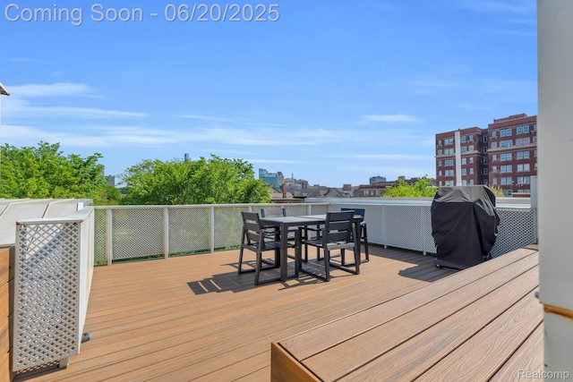 2648 John R St, Detroit, MI 48201 - wooden deck featuring grilling area and outdoor dining space
