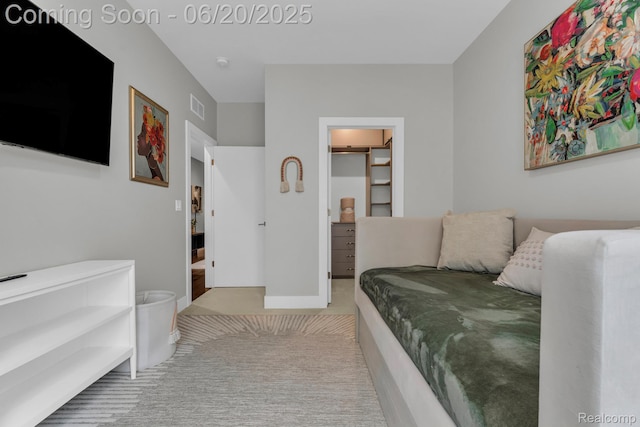 2648 John R St, Detroit, MI 48201 - bedroom with a spacious closet and carpet flooring