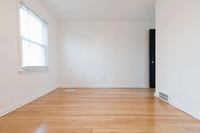 15821 Kentfield St, Detroit, MI 48223 - spare room with plenty of natural light and wood finished floors