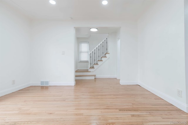 15821 Kentfield St, Detroit, MI 48223 - spare room with light wood finished floors, stairs, and recessed lighting