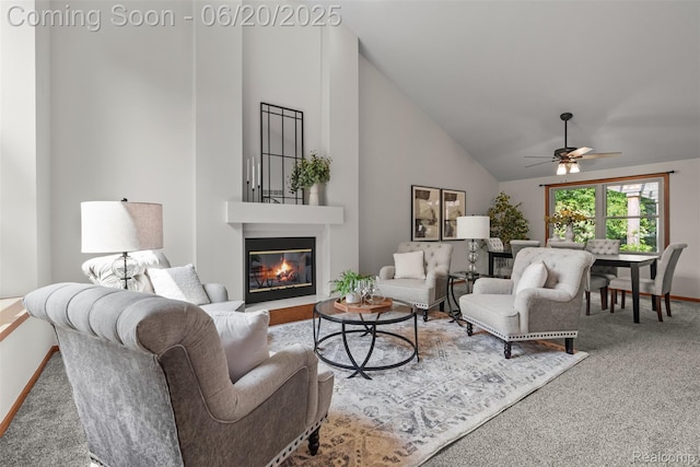 2206 Estates Dr, Highland, MI 48357 - living area featuring carpet flooring, a ceiling fan, a glass covered fireplace, and high vaulted ceiling