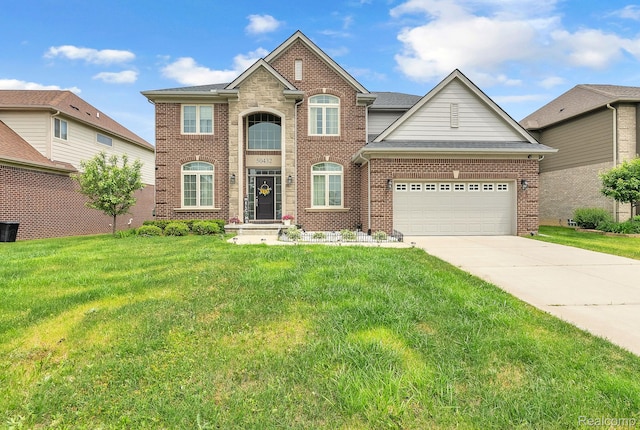 50432 Maywood, Dearborn, MI 48188 - view of front facade featuring brick siding, a front yard, driveway, and a garage