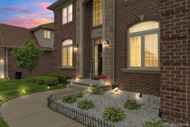 50432 Maywood, Dearborn, MI 48188 - exterior entry at dusk featuring brick siding
