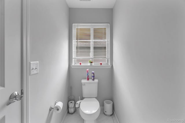 50432 Maywood, Dearborn, MI 48188 - bathroom featuring toilet and marble look tiles