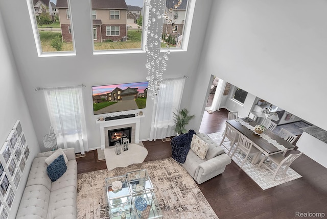 50432 Maywood, Dearborn, MI 48188 - living room with a towering ceiling, a glass covered fireplace, and wood finished floors