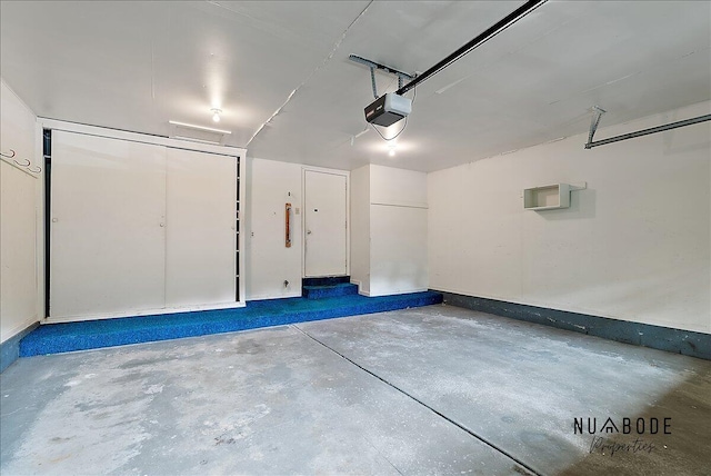 1427 Atlantic St NW, Grand Rapids, MI 49504 - garage featuring a garage door opener