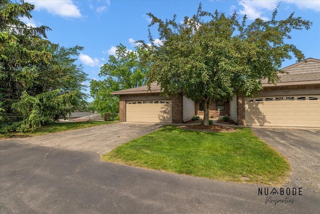 1427 Atlantic St NW, Grand Rapids, MI 49504 - view of front of house with brick siding, a garage, and a front yard