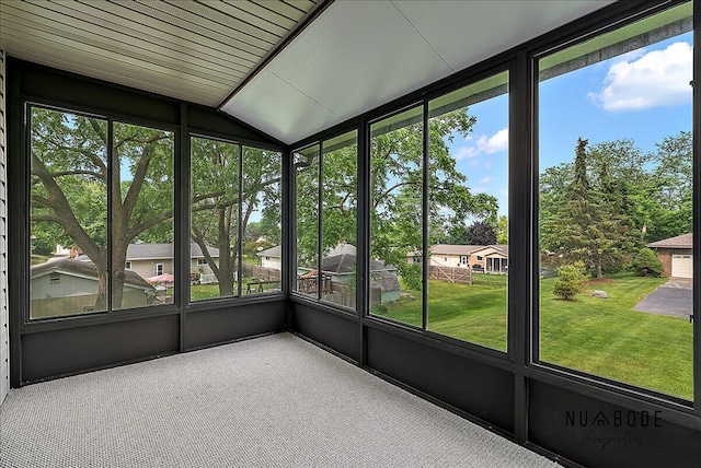1427 Atlantic St NW, Grand Rapids, MI 49504 - unfurnished sunroom featuring vaulted ceiling