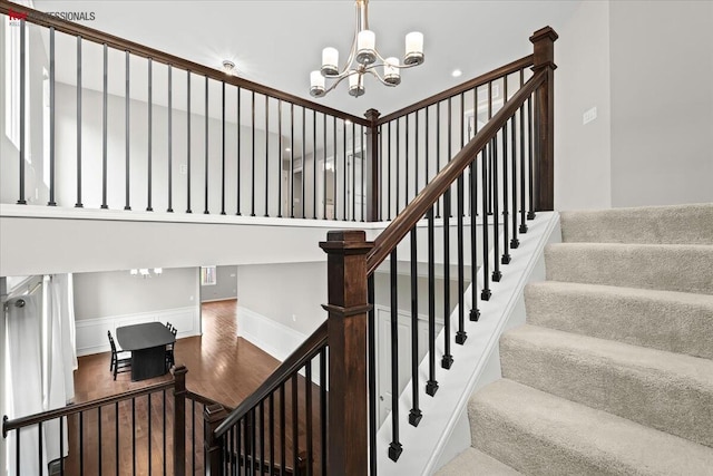 945 Reef Dr, Canton, MI 48187 - stairs featuring a chandelier and wood finished floors