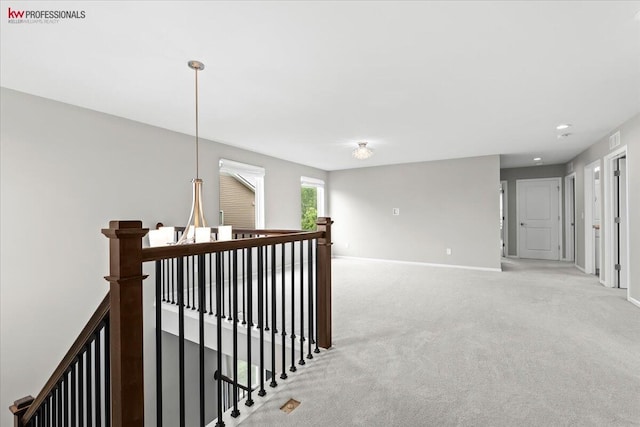 945 Reef Dr, Canton, MI 48187 - corridor with an upstairs landing and light colored carpet