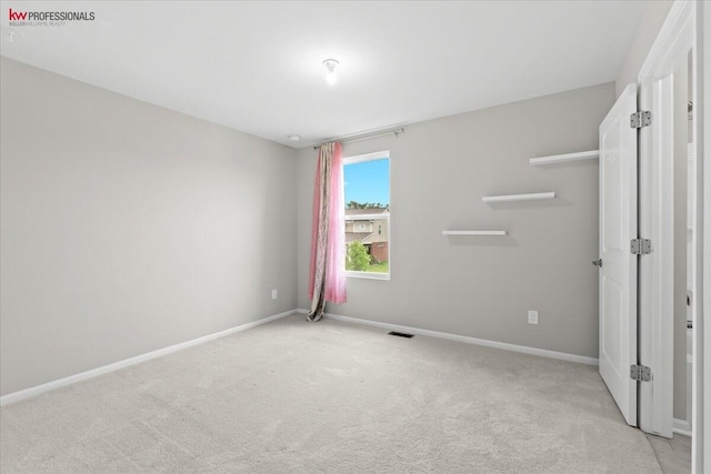 945 Reef Dr, Canton, MI 48187 - unfurnished bedroom featuring light colored carpet and baseboards