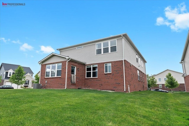 945 Reef Dr, Canton, MI 48187 - rear view of house with a lawn and brick siding