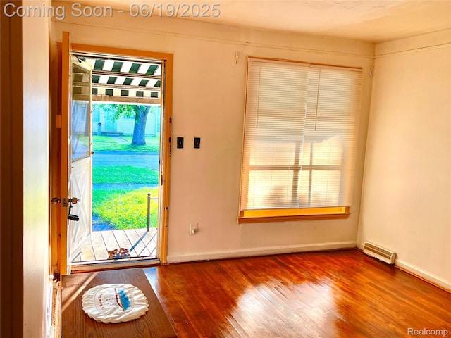 20760 Atlantic Ave, Warren, MI 48091 - doorway to outside featuring hardwood / wood-style floors and baseboards