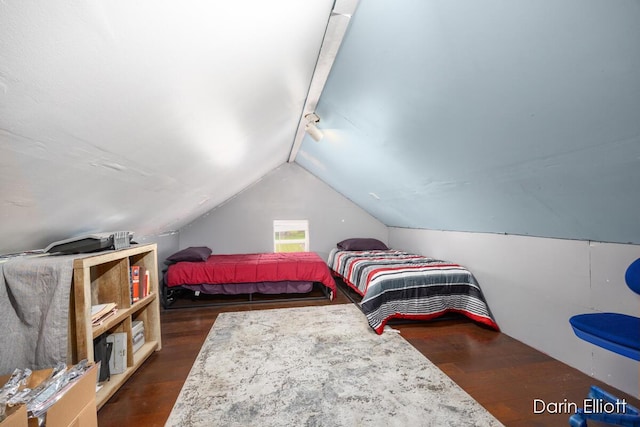 204 Maple St, Durand, MI 48429 - bedroom with dark wood-style flooring, lofted ceiling, and track lighting