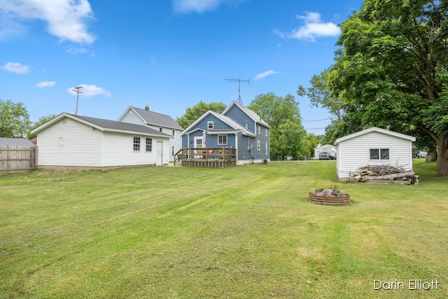 204 Maple St, Durand, MI 48429 - view of yard with an outdoor fire pit and a deck