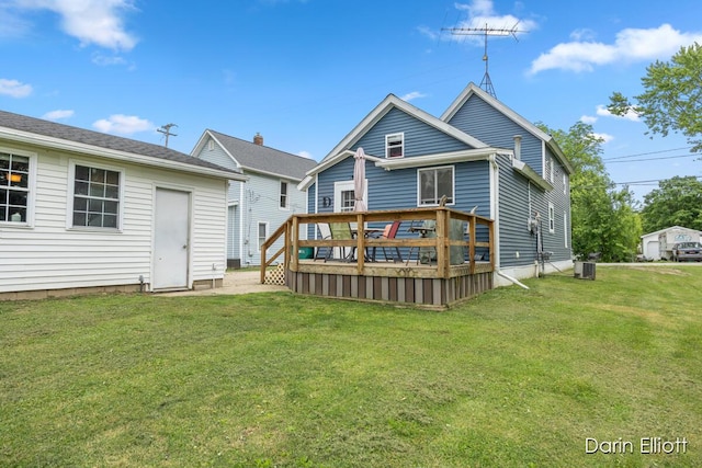 204 Maple St, Durand, MI 48429 - back of property with a wooden deck and a yard