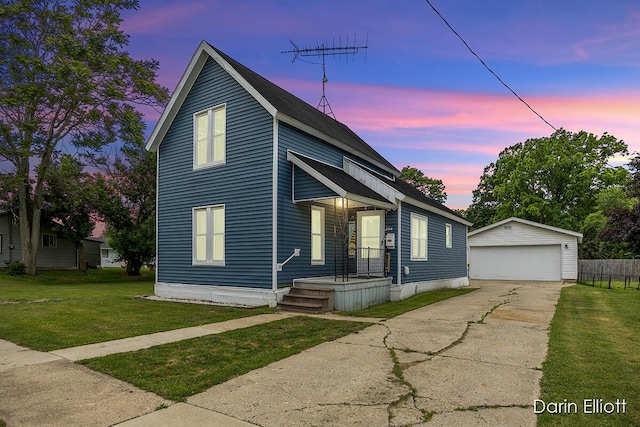 204 Maple St, Durand, MI 48429 - view of front of property with an outbuilding, a detached garage, and a front yard