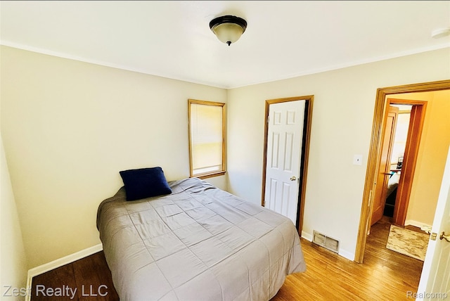 15684 Manning St, Detroit, MI 48205 - bedroom with wood finished floors and ornamental molding