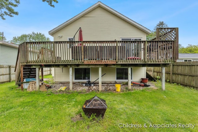 1300 Lancaster Ave NW, Grand Rapids, MI 49504 - back of house with a deck, stairs, and an outdoor fire pit
