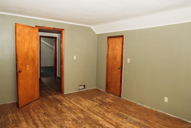 8667 Thompson Hwy, Blissfield, MI 49228 - unfurnished room with wood finished floors, crown molding, and lofted ceiling