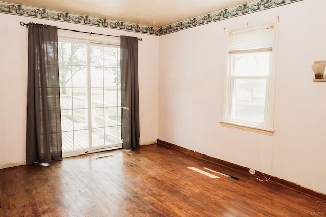 8667 Thompson Hwy, Blissfield, MI 49228 - empty room with wood finished floors and baseboards