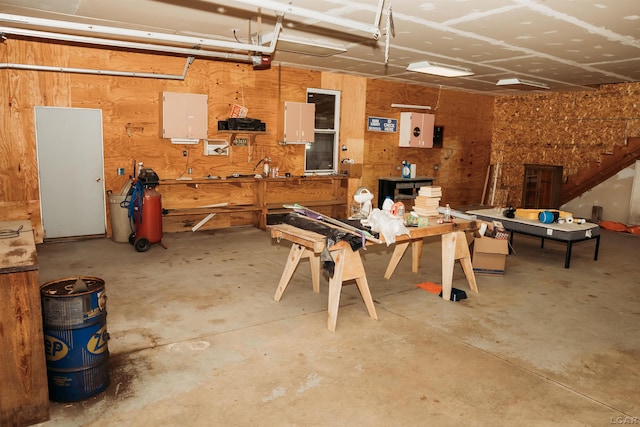 8667 Thompson Hwy, Blissfield, MI 49228 - garage with a workshop area and a garage door opener
