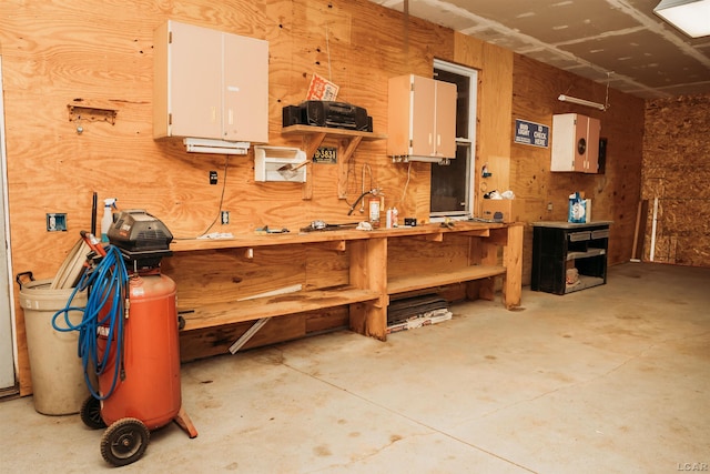 8667 Thompson Hwy, Blissfield, MI 49228 - misc room with a workshop area and concrete floors