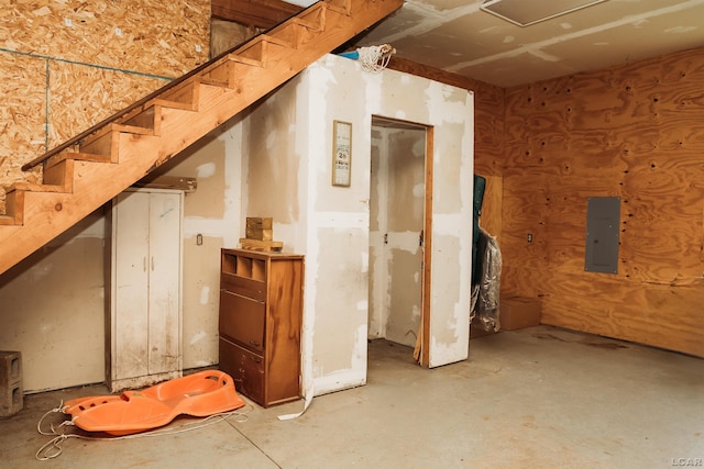 8667 Thompson Hwy, Blissfield, MI 49228 - below grade area featuring electric panel and stairway
