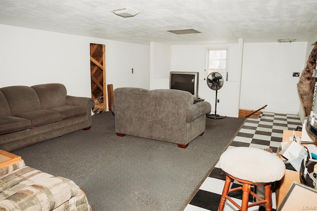 8667 Thompson Hwy, Blissfield, MI 49228 - living room with tile patterned floors and a textured ceiling