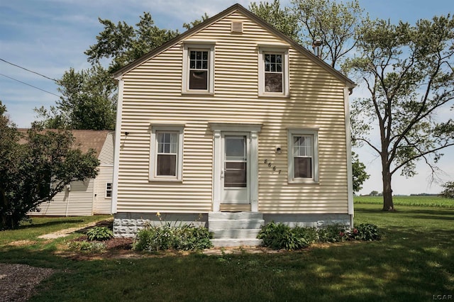 8667 Thompson Hwy, Blissfield, MI 49228 - back of property featuring a lawn and entry steps