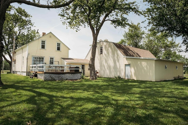 8667 Thompson Hwy, Blissfield, MI 49228 - rear view of house with a wooden deck, a yard, and a chimney
