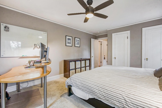 1515 E Stadium Blvd, Ann Arbor, MI 48104 - bedroom with light carpet, ornamental molding, a ceiling fan, and two closets
