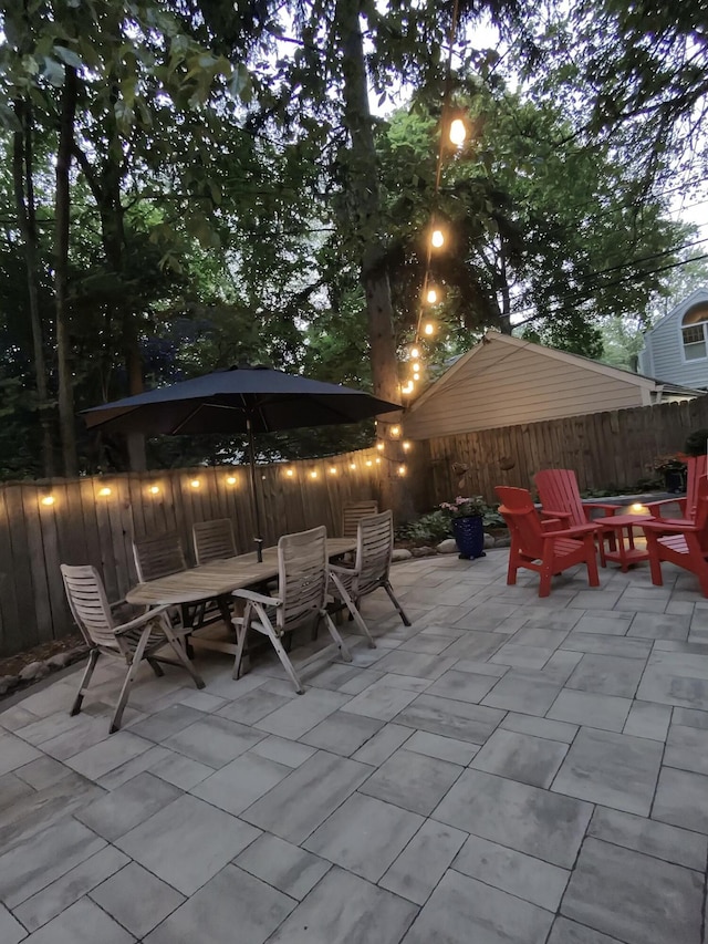 1515 E Stadium Blvd, Ann Arbor, MI 48104 - fenced backyard featuring outdoor dining space and a patio