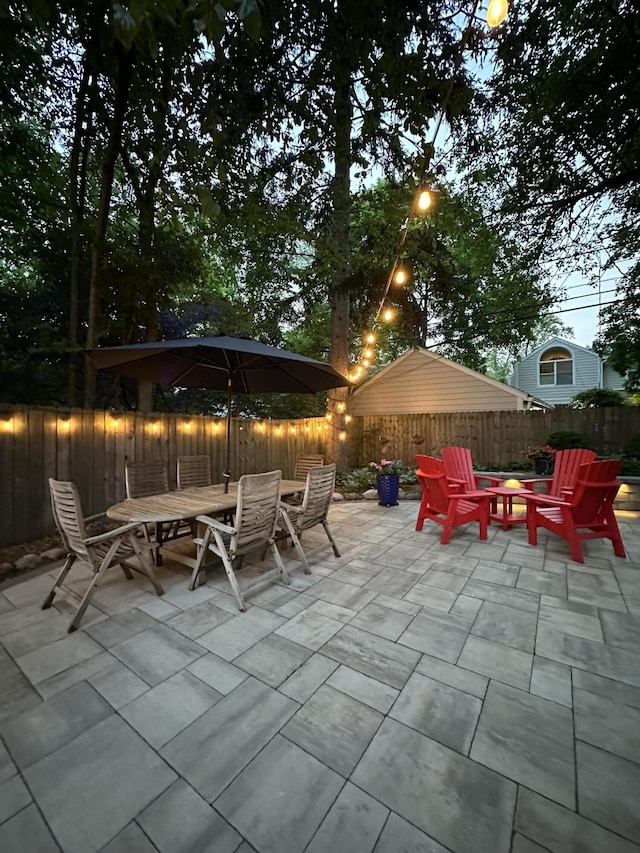 1515 E Stadium Blvd, Ann Arbor, MI 48104 - fenced backyard with a patio area, outdoor dining area, and an outdoor fire pit