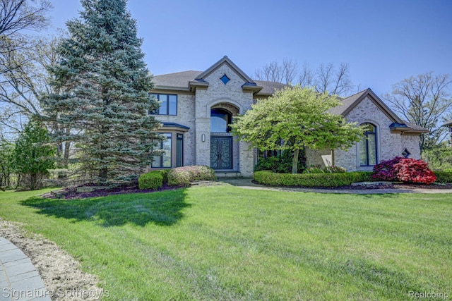 3225 Legacy Ct, West Bloomfield, MI 48323 - french provincial home with brick siding, a front lawn, and roof with shingles