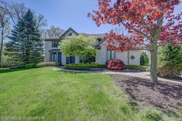 3225 Legacy Ct, West Bloomfield, MI 48323 - view of front of house featuring a front lawn and brick siding
