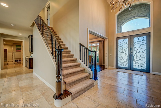 3225 Legacy Ct, West Bloomfield, MI 48323 - foyer entrance with stairs, french doors, a towering ceiling, recessed lighting, and a chandelier