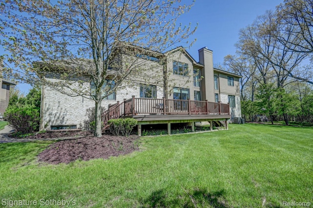 3225 Legacy Ct, West Bloomfield, MI 48323 - rear view of property featuring a deck, a chimney, and a yard