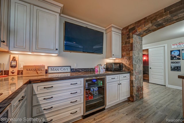 3225 Legacy Ct, West Bloomfield, MI 48323 - kitchen featuring beverage cooler and light wood-style flooring