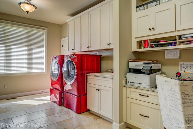 3225 Legacy Ct, West Bloomfield, MI 48323 - laundry area with independent washer and dryer, cabinet space, and stone tile floors