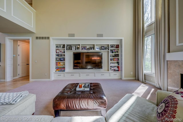 3225 Legacy Ct, West Bloomfield, MI 48323 - living area with a towering ceiling and carpet floors