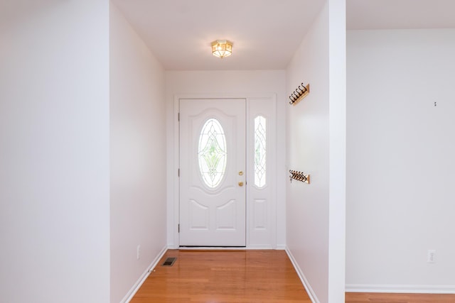 4351 Knollcrest Dr, Ann Arbor, MI 48108 - entrance foyer featuring light wood-style flooring and baseboards