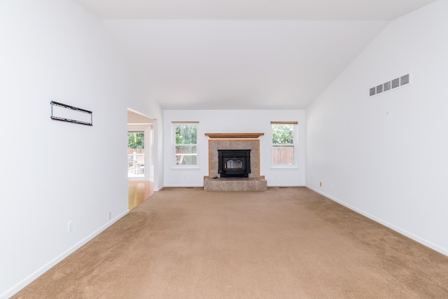 4351 Knollcrest Dr, Ann Arbor, MI 48108 - unfurnished living room with light carpet, high vaulted ceiling, and a tiled fireplace