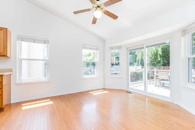 4351 Knollcrest Dr, Ann Arbor, MI 48108 - unfurnished living room featuring light wood-style flooring, vaulted ceiling, healthy amount of natural light, and ceiling fan