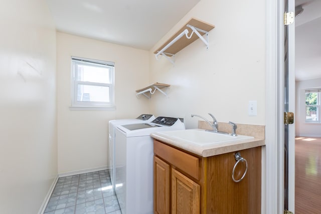 4351 Knollcrest Dr, Ann Arbor, MI 48108 - laundry area featuring washing machine and dryer and cabinet space