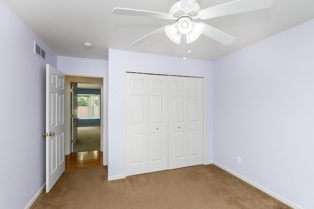4351 Knollcrest Dr, Ann Arbor, MI 48108 - unfurnished bedroom featuring carpet, a closet, and ceiling fan