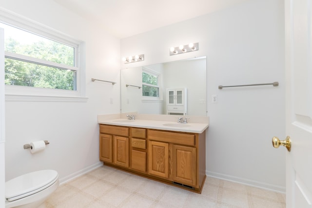 4351 Knollcrest Dr, Ann Arbor, MI 48108 - full bath with double vanity, plenty of natural light, and tile patterned floors