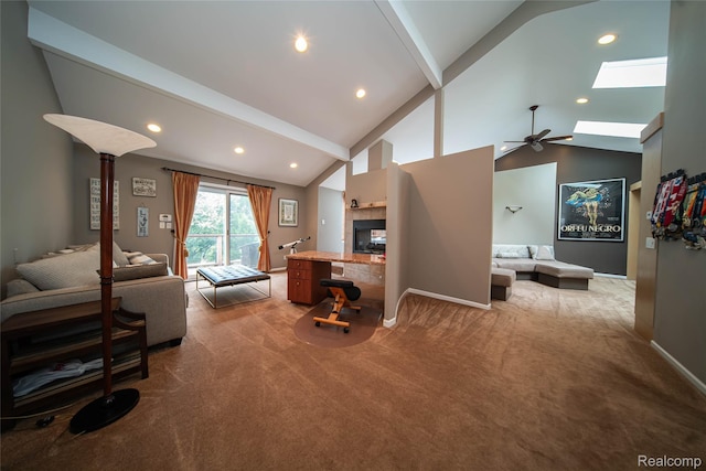 4683 Maura Ln, West Bloomfield, MI 48323 - carpeted living area with a fireplace, ceiling fan, a skylight, recessed lighting, and beamed ceiling