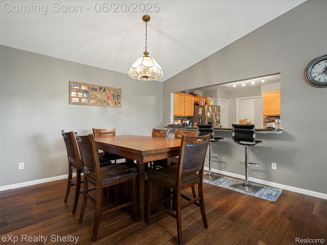 16436 Grandview Dr, Macomb, MI 48044 - dining space featuring dark wood-style floors, lofted ceiling, and a chandelier
